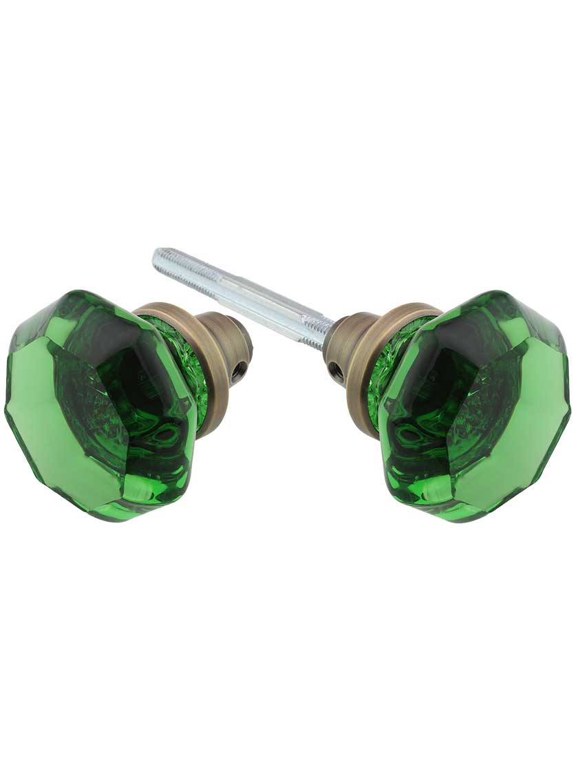 Pair of Emerald Octagonal Crystal Glass Door Knobs in Antique Brass.